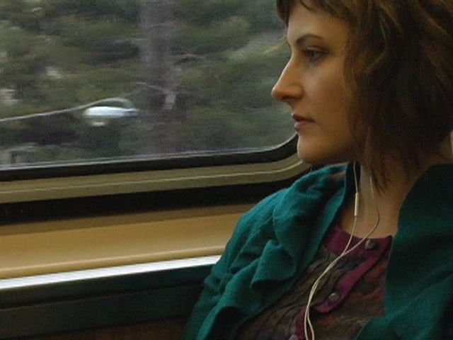 A women looks out a train window